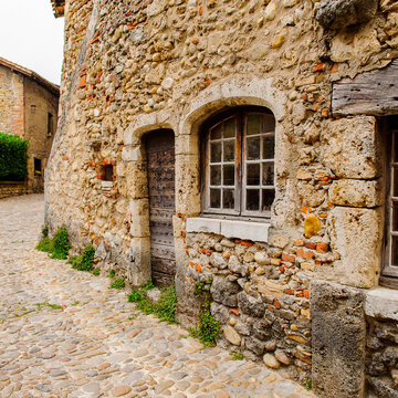 Street of Perouges, France, a medieval walled town, a popular touristic attraction.