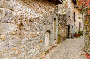 Narrow street in  Perouges, France, a medieval walled town, a popular touristic attraction.