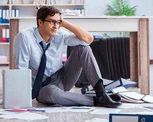 Bankrupt businessman angry in the office floor