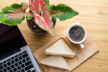 Crab sandwich for break on working desk, top view..
