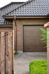 Fragment of two-car garage with pull-up doors. Selective focus.