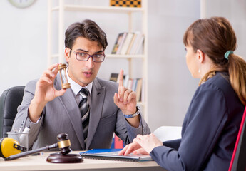 Lawyer talking to client in office