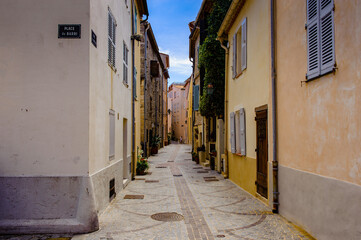 Fototapeta na wymiar It's Street in the Old town of Antibes, Cote d'Azur, France. Antibes was founded as a 5th-century BC Greek colony and was called Antipolis