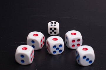 Group of dices isolated over dark background