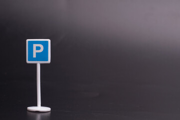 A parking sign isolated over dark background
