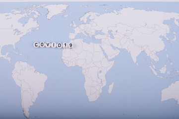 The word covid 19 over world map,high angle shot