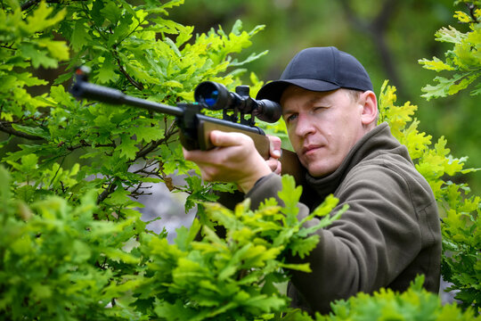 Male With A Gun In Hunting Period