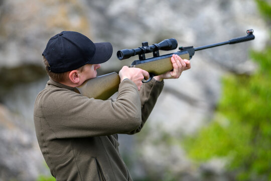 Male With A Gun In Hunting Period