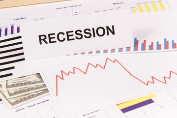 Inscription recession, currencies dollar and downward graphs representing financial crisis caused by coronavirus. Covid-19