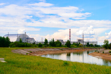 Fototapeta na wymiar New Safe Confinement (NSC or Shelter), a structure built to contain the remains of 4th reactor unit at the Chernobyl Nuclear Power Plant Ukraine