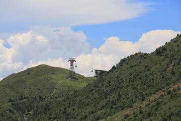 cable car tower with the cloudy landscape from Lantau Island in beautiful summer landscape