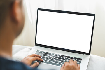 Mock up Blank screen laptop on the bed for advertising and text.