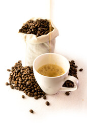 bag of coffee beans with cup of fresh coffee