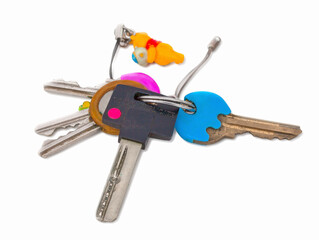 Childish house keys. Isolated on white background natural shadow. With clipping path. With vector path. Many keys connected by a metal ring.