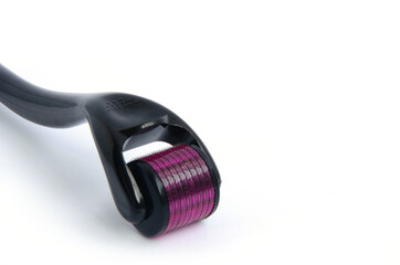 Meso roller tool for face, skin care roller for skin close up on a white background.