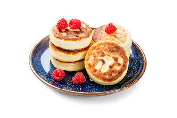 Cottage cheese fritters or syrniki with fresh raspberries. Tasty dessert or sweet breakfast. Russian, Ukrainian cuisine food. isolated on white background