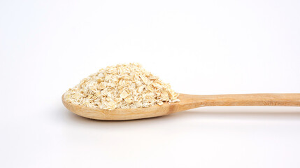 Oatmeal in a wooden spoon on a white background.