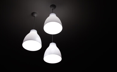 White electric light three lamps hanging on ceiling interior background