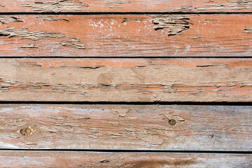 Texture of old wooden surface with peeled paint