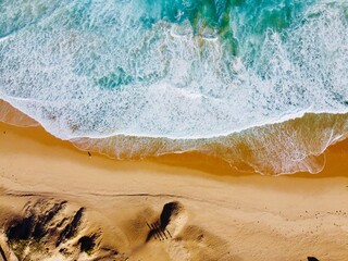 waves on the sand australia - obrazy, fototapety, plakaty