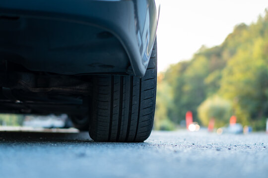 Cluj-Napoca, Cluj/Romania-11.10.2019-Summer Tire Profile, Signs Of Wear, Picture Taken From Behind, Close Up, No People, Rear Bumper, Exhaust Pipe