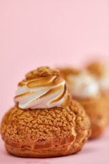 Tasty sweet cupcakes on the pink background