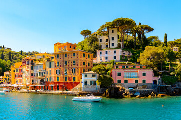 Obraz premium It's Portofino, is an Italian fishing village, Genoa province, Italy. A vacation resort with a picturesque harbour and with celebrity and artistic visitors.