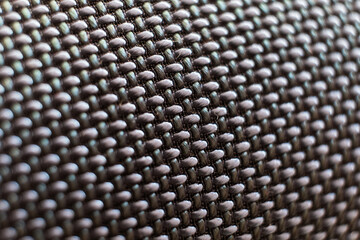  close up shot speaker bluetooth. fabric texture. Macro mode. No people. 