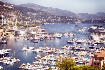 View of the Principality of Monaco and port with sailing and fishing boats