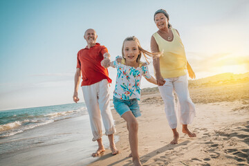 happy retired seniors with family in summertime
