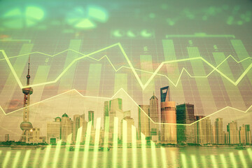 Forex graph on city view with skyscrapers background double exposure. Financial analysis concept.