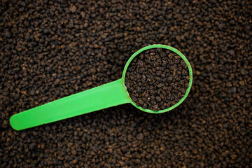 spoon of black tea powder ,chai patti or dry dust without green leavesi