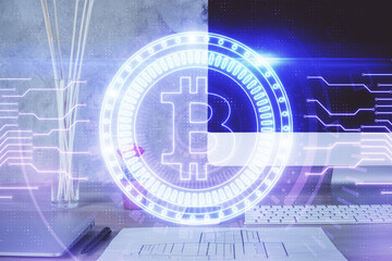 Double exposure of blockchain and crypto economy theme hologram and table with computer background. Concept of bitcoin cryptocurrency.