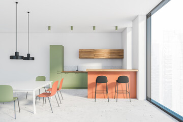 Green and orange kitchen, bar and table, side view