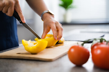 Woman Cooking Dinner At Home