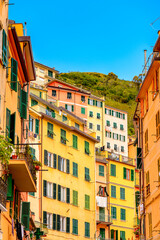 Obraz premium It's Houses in Riomaggiore (Rimazuu), a village in province of La Spezia, Liguria, Italy. It's one of the lands of Cinque Terre, UNESCO World Heritage Site