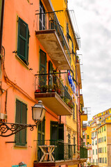 Fototapeta na wymiar It's Houses in Riomaggiore (Rimazuu), a village in province of La Spezia, Liguria, Italy. It's one of the lands of Cinque Terre, UNESCO World Heritage Site
