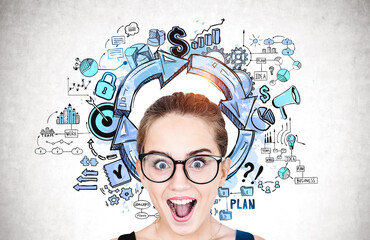 Astonished teen girl in glasses, business plan