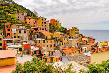 It's Panorama of Riomaggiore (Rimazuu), a village in province of La Spezia, Liguria, Italy. It's one of the lands of Cinque Terre, UNESCO World Heritage Site