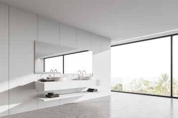 Panoramic white bathroom corner with double sink