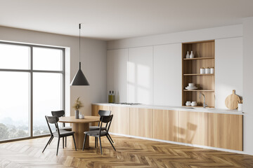 White and wooden kitchen corner with dining table