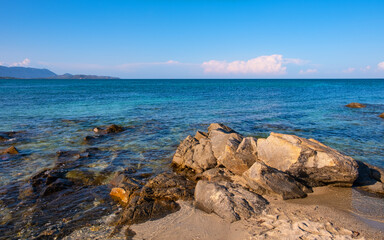 Panoramic view of coast of Tyrrhenian Sea and Isola Molara island seen from San Teodoro resort town in Sardinia, Italy