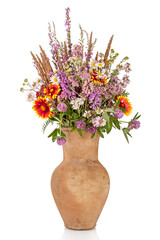 Beautiful Bright Wild flowers bouquet in vase. Holiday symbol