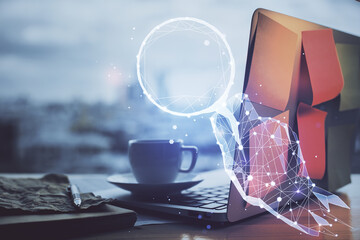 Desktop computer background in office and start up theme hologram drawing. Double exposure. Startup...