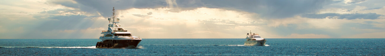 Obraz premium Two yachts in the sea panorama
