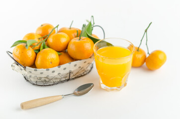 Mandarin juice and fresh mandarin fruits on white background