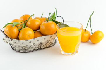 Mandarin juice and fresh mandarin fruits on white background