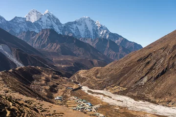 Fotobehang Ama Dablam Pheriche village with Kangtega and Thamserku mountain peak behind. A village in Everest base camp trekking route. Himalaya mountains range in Nepal