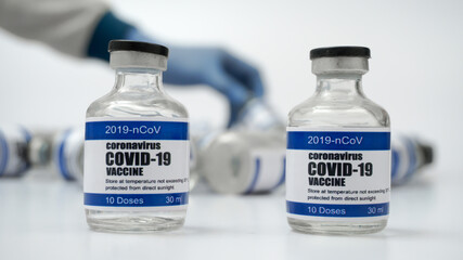 Covid-19 Corona Virus 2019-ncov vaccine vials medicine drug bottles syringe injection blue nitrile...