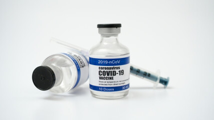 Covid-19 Corona Virus 2019-ncov vaccine vials medicine drug bottles syringe injection. Vaccination, immunization, treatment to cure Covid 19 Corona Virus infection. Healthcare And Medical concept.